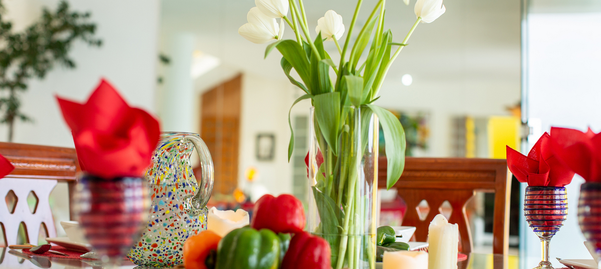 Festive dining table with tulips and candles