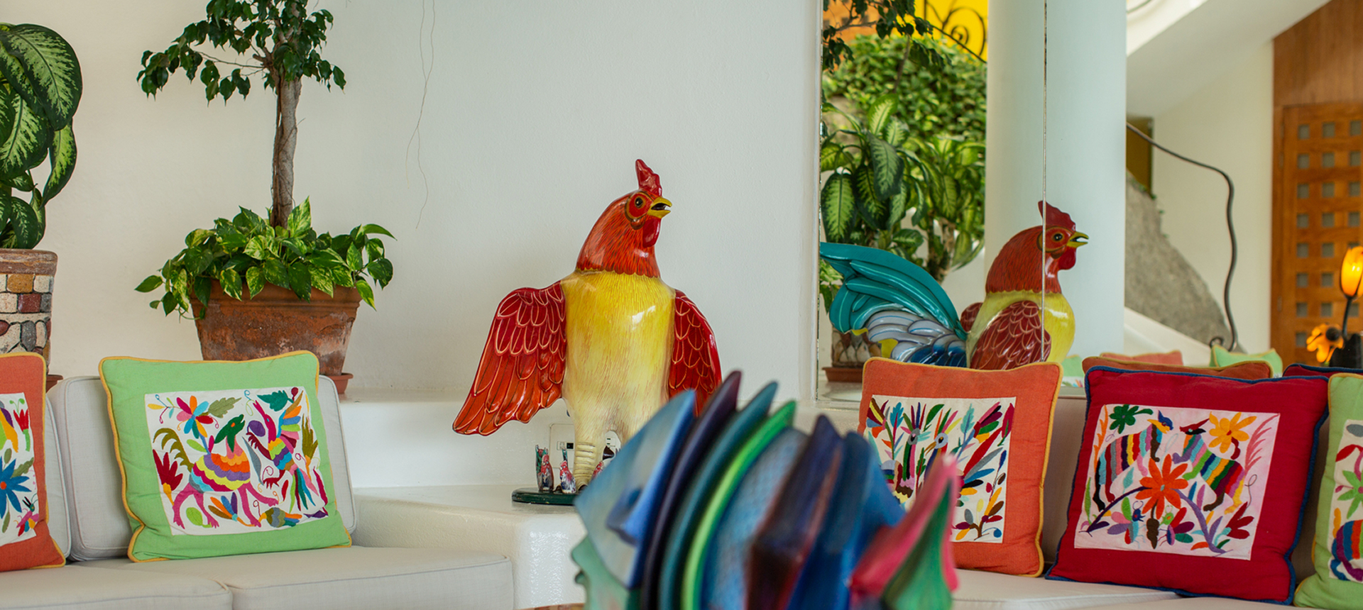 Colorful cushions and rooster decor