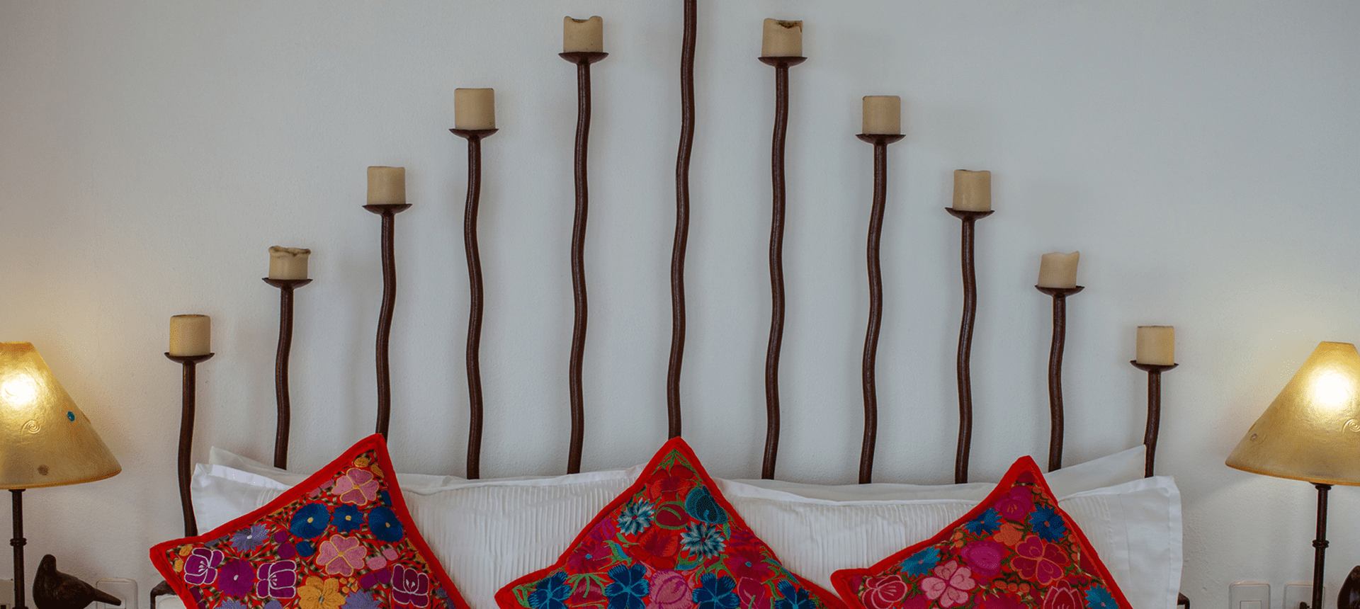 Unique headboard design with vibrant cushions